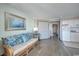 Cozy living room with sleeper sofa, kitchenette, and wood-look floors, offers a relaxing space at 6900 N Ocean Blvd. # 1505, Myrtle Beach, SC 29572