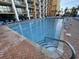 Triangular pool with steps, rail and shallow depths offers a relaxing place to swim at 6900 N Ocean Blvd. # 1505, Myrtle Beach, SC 29572