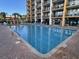 A crystal clear outdoor pool with patio and a building in the background at 6900 N Ocean Blvd. # 1505, Myrtle Beach, SC 29572