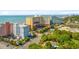 Aerial view of resort buildings, lush landscaping, roads, parking, and the ocean in the background at 6900 N Ocean Blvd. # 735, Myrtle Beach, SC 29572