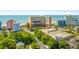 A high angle view of the resort buildings, a large parking lot, roads, and the distant beach at 6900 N Ocean Blvd. # 735, Myrtle Beach, SC 29572