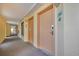 Hallway view with doors and room number signs in a hotel or condo building at 6900 N Ocean Blvd. # 735, Myrtle Beach, SC 29572