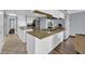 Bright kitchen island features marble countertop, and white cabinets at 6900 N Ocean Blvd. # 735, Myrtle Beach, SC 29572