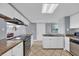 Bright kitchen featuring marble countertops, white cabinetry, and stainless steel appliances at 6900 N Ocean Blvd. # 735, Myrtle Beach, SC 29572