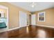 Bright bedroom with hardwood floors, double closets, and an ensuite bathroom, offering comfort and convenience at 708 48Th Ave. N, Myrtle Beach, SC 29577