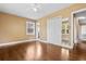 Well-lit bedroom with hardwood floors, large closet, and easy access to a hallway for added convenience at 708 48Th Ave. N, Myrtle Beach, SC 29577