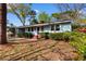 Charming one-story home featuring blue siding, mature landscaping and a brick porch at 708 48Th Ave. N, Myrtle Beach, SC 29577