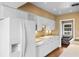 Bright kitchen featuring white cabinets, modern appliances, and ample counter space at 708 48Th Ave. N, Myrtle Beach, SC 29577