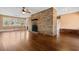 Spacious living room featuring hardwood floors and a striking brick fireplace at 708 48Th Ave. N, Myrtle Beach, SC 29577