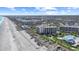 Breathtaking aerial view of a beachfront condo offering ocean views and convenient beach access at 741 Retreat Beach Circle # B-1-F, Pawleys Island, SC 29585