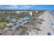 Stunning aerial view of a condo complex on the beach with boardwalk, grilling area, and ocean access at 741 Retreat Beach Circle # B-1-F, Pawleys Island, SC 29585