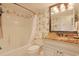 Bathroom with a bathtub and shower combination, toilet and vanity with granite counter top at 741 Retreat Beach Circle # B-1-F, Pawleys Island, SC 29585