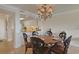 Cozy dining area featuring a round table, decorative lighting, and an open view into the kitchen space at 741 Retreat Beach Circle # B-1-F, Pawleys Island, SC 29585