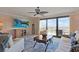 Comfortable living room with plush seating, large screen TV, and sliding glass doors to the balcony at 741 Retreat Beach Circle # B-1-F, Pawleys Island, SC 29585