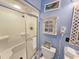 Cozy bathroom features a standing shower and a toilet with storage and coastal decor at 800 Castleford Circle # 1-E, Myrtle Beach, SC 29572