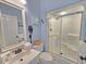 Bathroom featuring a stand up shower, sink with storage and toilet with coastal decor at 800 Castleford Circle # 1-E, Myrtle Beach, SC 29572