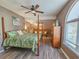 Bedroom featuring a four poster bed, ceiling fan and lots of natural light at 800 Castleford Circle # 1-E, Myrtle Beach, SC 29572