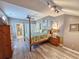Bedroom featuring a four poster bed and en-suite bathroom at 800 Castleford Circle # 1-E, Myrtle Beach, SC 29572