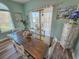 Dining room features a large glass top table with seating and access to a balcony at 800 Castleford Circle # 1-E, Myrtle Beach, SC 29572