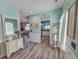 Hallway with coastal decor that connects living spaces with decorative mirror and console at 800 Castleford Circle # 1-E, Myrtle Beach, SC 29572
