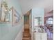 Hallway features coastal-themed artwork and decor leading to the living room at 800 Castleford Circle # 1-E, Myrtle Beach, SC 29572