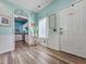Hallway featuring coastal decor and an arched entrance to the kitchen at 800 Castleford Circle # 1-E, Myrtle Beach, SC 29572
