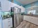 Efficient kitchen with stainless steel appliances, granite countertops and wood floors at 800 Castleford Circle # 1-E, Myrtle Beach, SC 29572