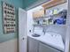 Laundry room with washer, dryer, and shelving for storage at 800 Castleford Circle # 1-E, Myrtle Beach, SC 29572