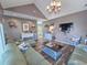 Well-decorated living room with vaulted ceiling, stylish furniture and modern lighting at 800 Castleford Circle # 1-E, Myrtle Beach, SC 29572