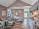 Inviting living area with a vaulted ceiling, wood floors and neutral decor at 800 Castleford Circle # 1-E, Myrtle Beach, SC 29572