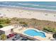 Overhead view of a pool near a beach and parking lot at 800 Castleford Circle # 1-E, Myrtle Beach, SC 29572