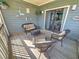 Relaxing porch area features comfortable wicker seating and views of the interior at 800 Castleford Circle # 1-E, Myrtle Beach, SC 29572