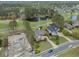 Expansive aerial shot featuring the golf course, pond, neighboring homes, and a construction site nearby at 9278 Nw Checkerberry Square, Calabash, NC 28467