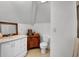 Cozy bathroom with a vanity sink, a wooden cabinet, and a neutral-toned tiled floor at 9278 Nw Checkerberry Square, Calabash, NC 28467