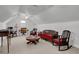 Spacious bonus room with unique decor, comfortable seating, and bright, natural light at 9278 Nw Checkerberry Square, Calabash, NC 28467
