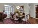 Elegant dining room with decorative chairs, a gorgeous chandelier, and an antique china cabinet at 9278 Nw Checkerberry Square, Calabash, NC 28467