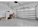 Spacious garage offering ample storage with a clean, well-lit interior and stairs to an upper level at 9278 Nw Checkerberry Square, Calabash, NC 28467