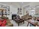 Inviting living room featuring a fireplace with built-in shelving and comfortable seating at 9278 Nw Checkerberry Square, Calabash, NC 28467