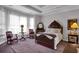 Spacious main bedroom with a decorative bed frame, ample natural light, and elegant furnishings at 9278 Nw Checkerberry Square, Calabash, NC 28467