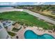 Aerial view of a resort featuring a pool, patio, and lush landscaping at 9400 Shore Dr. # 506, Myrtle Beach, SC 29572