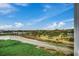 Expansive aerial view highlighting the coastal landscape, beach, golf course, and waterfront at 9400 Shore Dr. # 506, Myrtle Beach, SC 29572