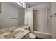 Functional bathroom with a single sink vanity, toilet, tub, shower and neutral color palette at 9400 Shore Dr. # 506, Myrtle Beach, SC 29572