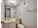 Standard bathroom features a single sink vanity, toilet, large mirror, and neutral color palette at 9400 Shore Dr. # 506, Myrtle Beach, SC 29572