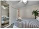 Bedroom featuring a full-length mirror and nautical-themed bedding and accents at 9400 Shore Dr. # 506, Myrtle Beach, SC 29572
