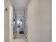 Bright condo hallway with tile flooring, a mirrored wall, and access to other rooms at 9400 Shore Dr. # 506, Myrtle Beach, SC 29572