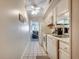 Efficient white kitchen with essential appliances and an open view to the living area at 9400 Shore Dr. # 506, Myrtle Beach, SC 29572