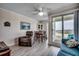 Bright living room featuring comfortable seating and a sliding glass door with balcony access at 9400 Shore Dr. # 506, Myrtle Beach, SC 29572