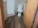 Simple bathroom design with laminate wood flooring and glass door shower at 9540 Shore Dr. # 3-H, Myrtle Beach, SC 29572