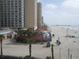 Coastal view of the ocean, sandy beach, pier, and hotels at 9540 Shore Dr. # 3-H, Myrtle Beach, SC 29572