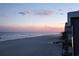 Panoramic ocean view during sunset showing buildings and sandy beach at 9540 Shore Dr. # 3-H, Myrtle Beach, SC 29572